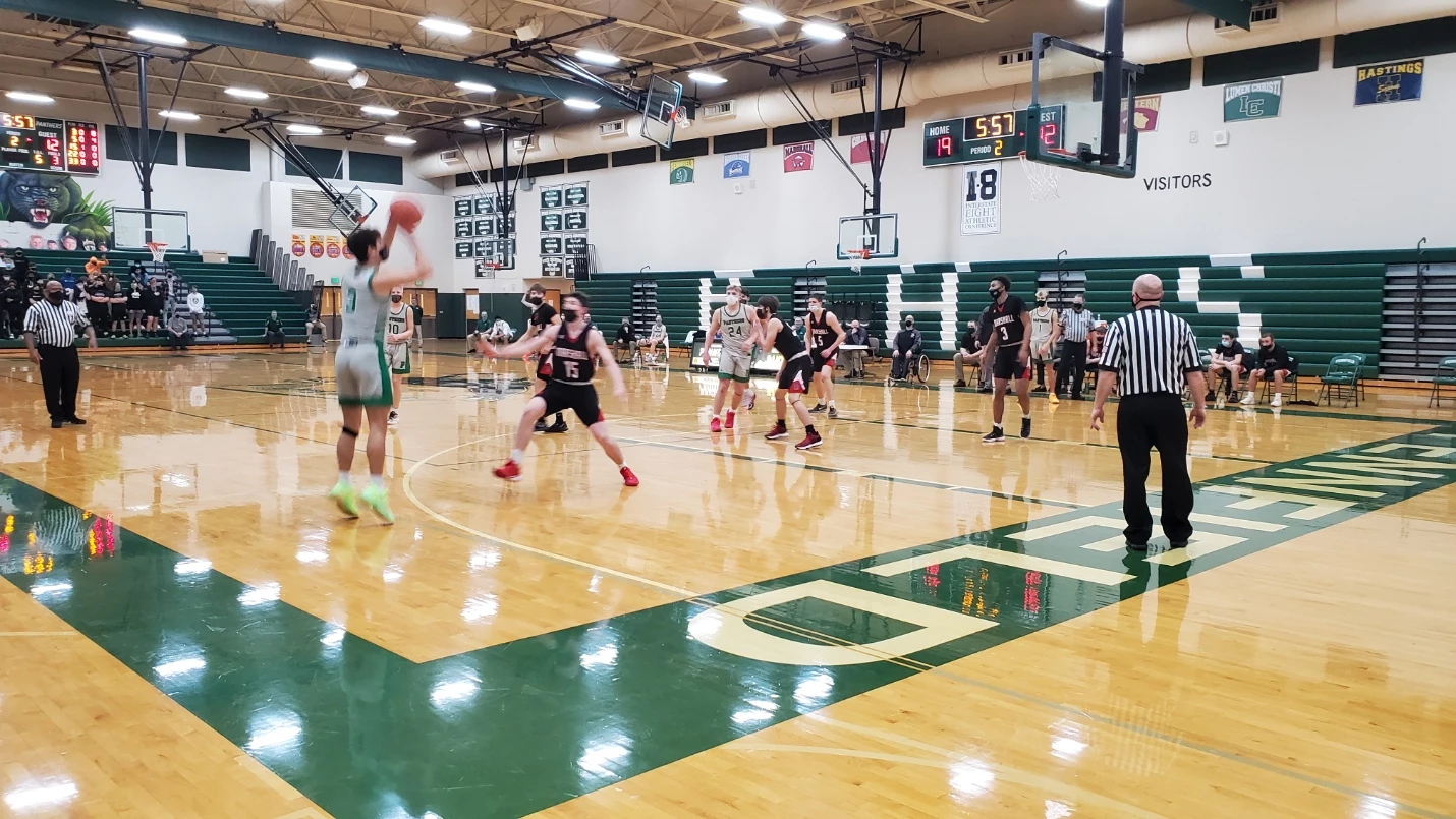 Pennfield's Gavin Liggett (3) puts up a three against Marshall in their March 9, 2021, contest. (Photo - Nathan Adams)